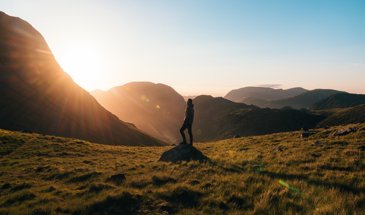 a hiker hiking in a valley